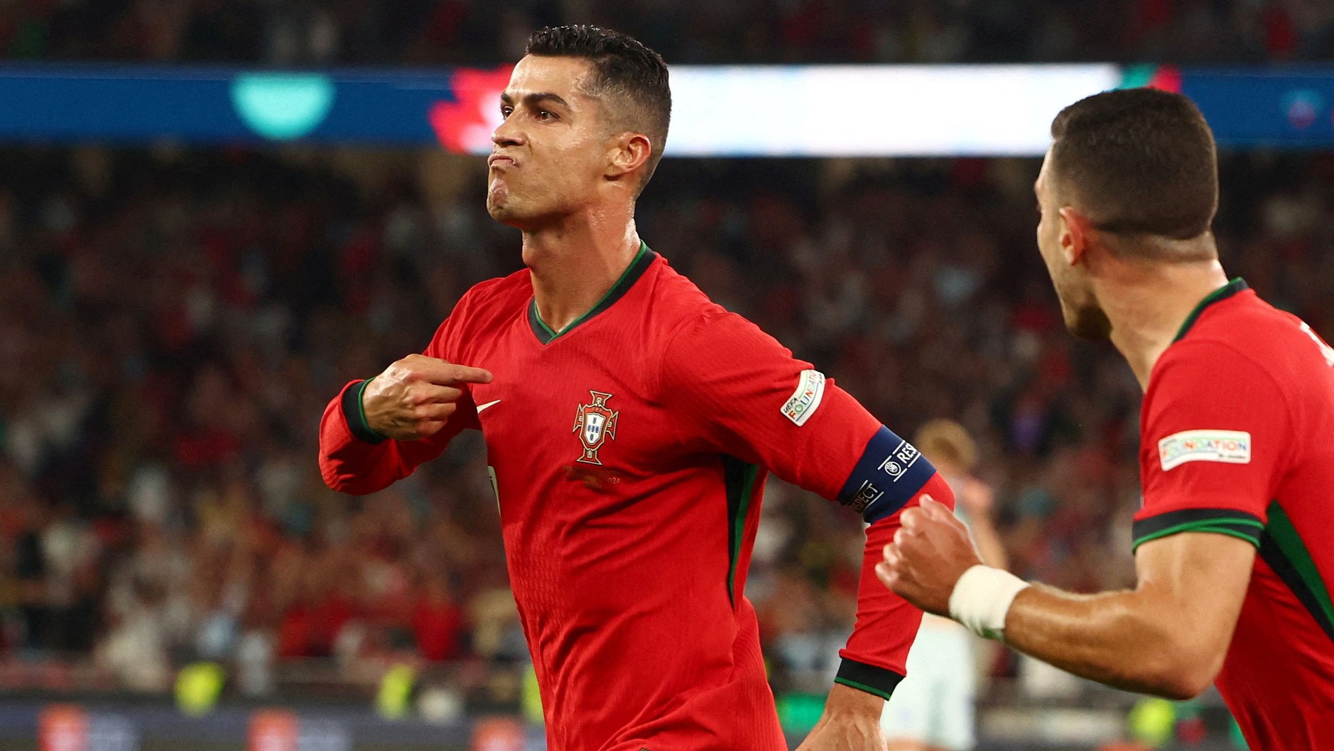 <div class="paragraphs"><p>Portugal's Cristiano Ronaldo celebrates scoring their second goal with Diogo Dalot</p></div>